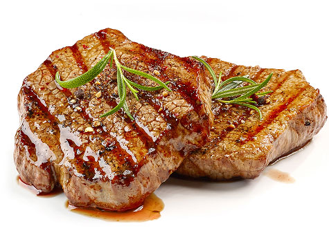 Two juicy sirloin steaks with rosemary garnish