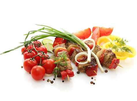 Pork and veggie kabobs with tomatoes, peppers, and onions.