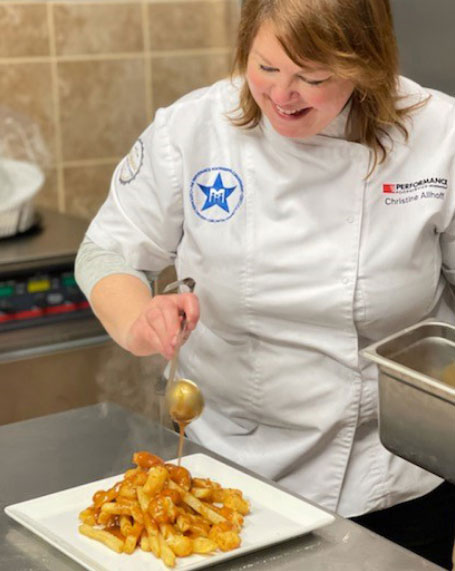 Chef Allhoff preparing a dish 