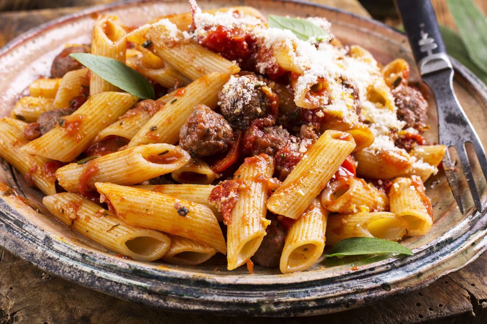 Pasta in sauce with parmesan cheese