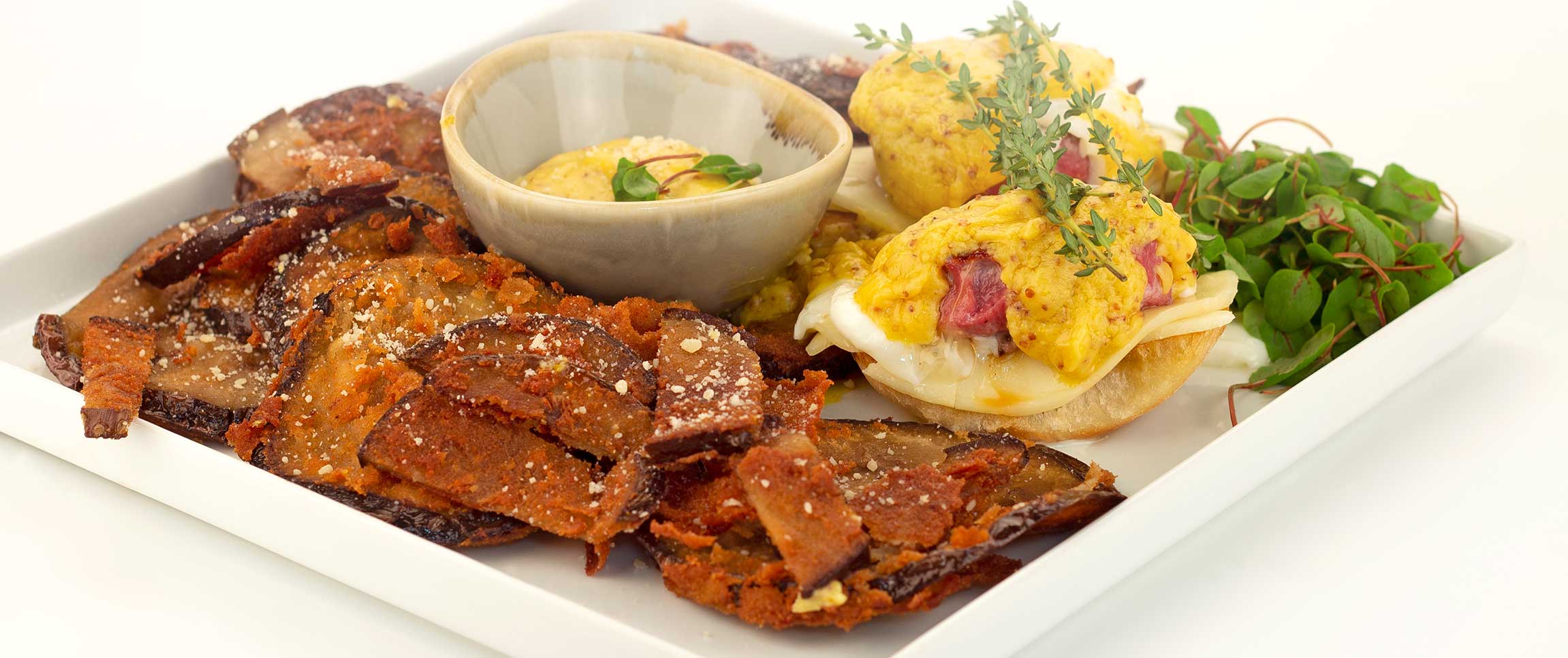 Eggs Benedict with ground corn beef and a Hot Mustard Hollandaise 