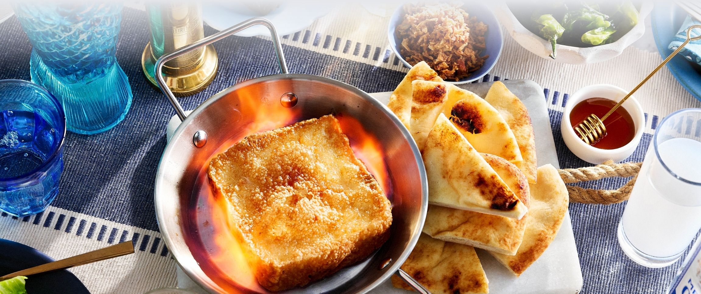Saganaki and Shishito Peppers