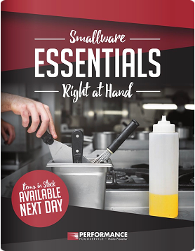 Smallwares Guide showing kitchen utensils in a metal container in a commercial kitchen.